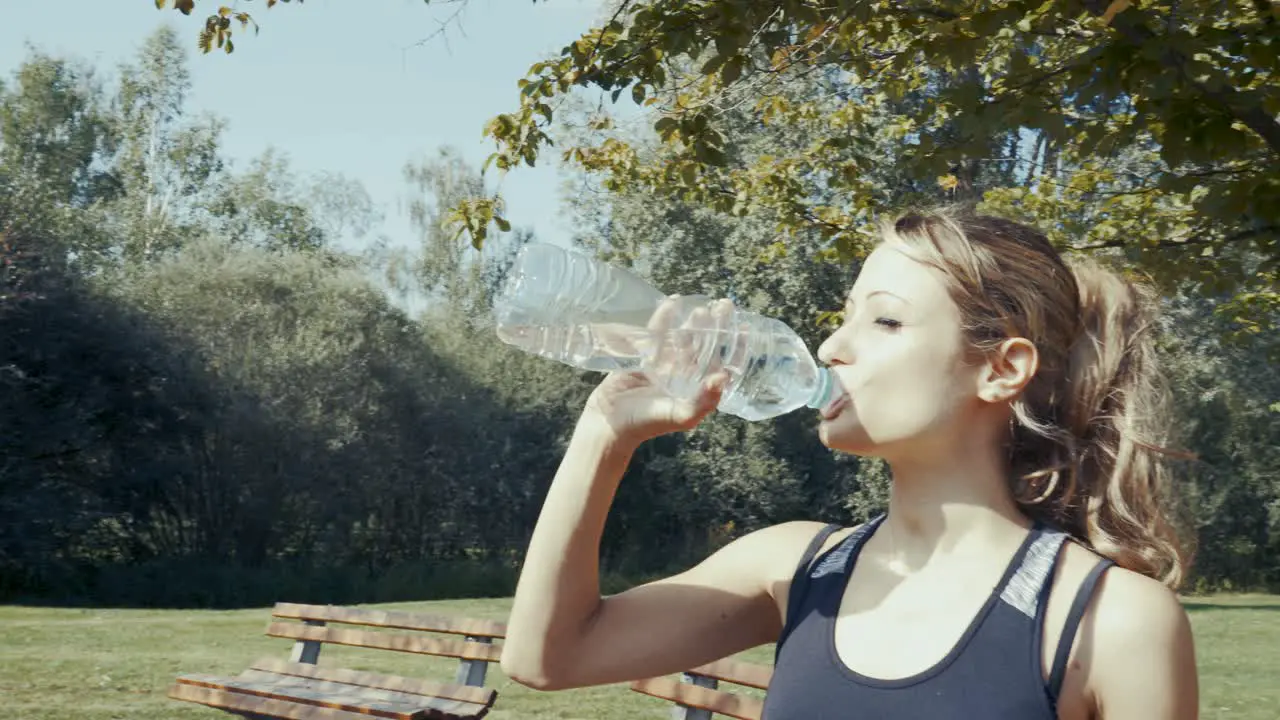 4k shot of young beautiful women doing exercises outdoor in a park at sunrise