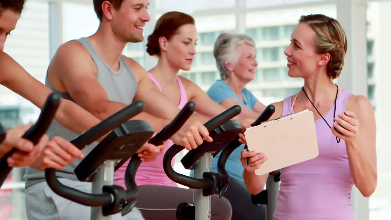 Happy group doing a spinning class