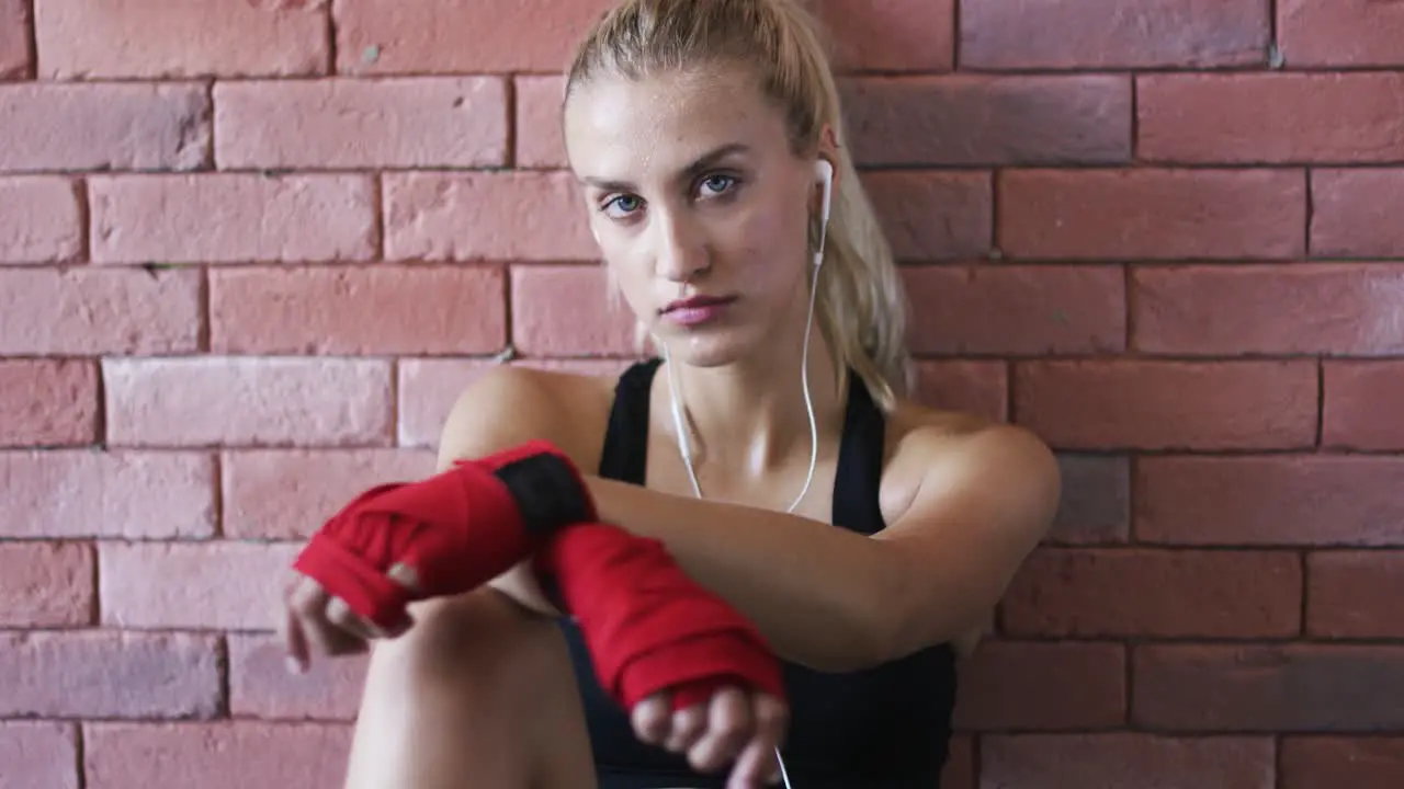 Relaxed sportswoman listening to music