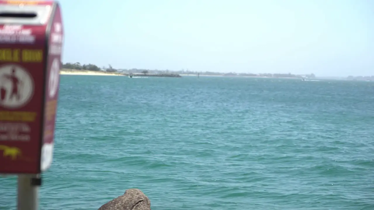 Fishing gear rubbish bin by the ocean with a slow pan