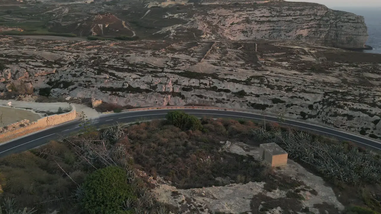 Aerial Footage of a runner male jogging in the mountains