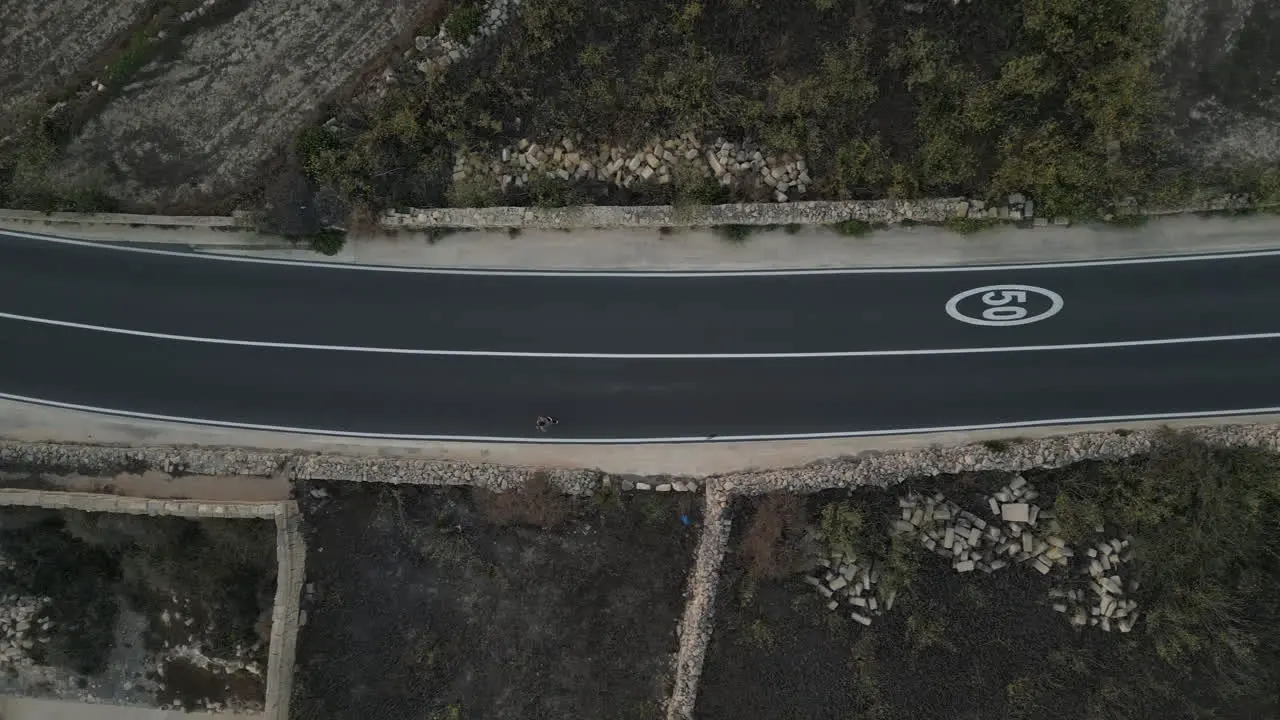 Aerial Top down View Of A Man Running jogging man