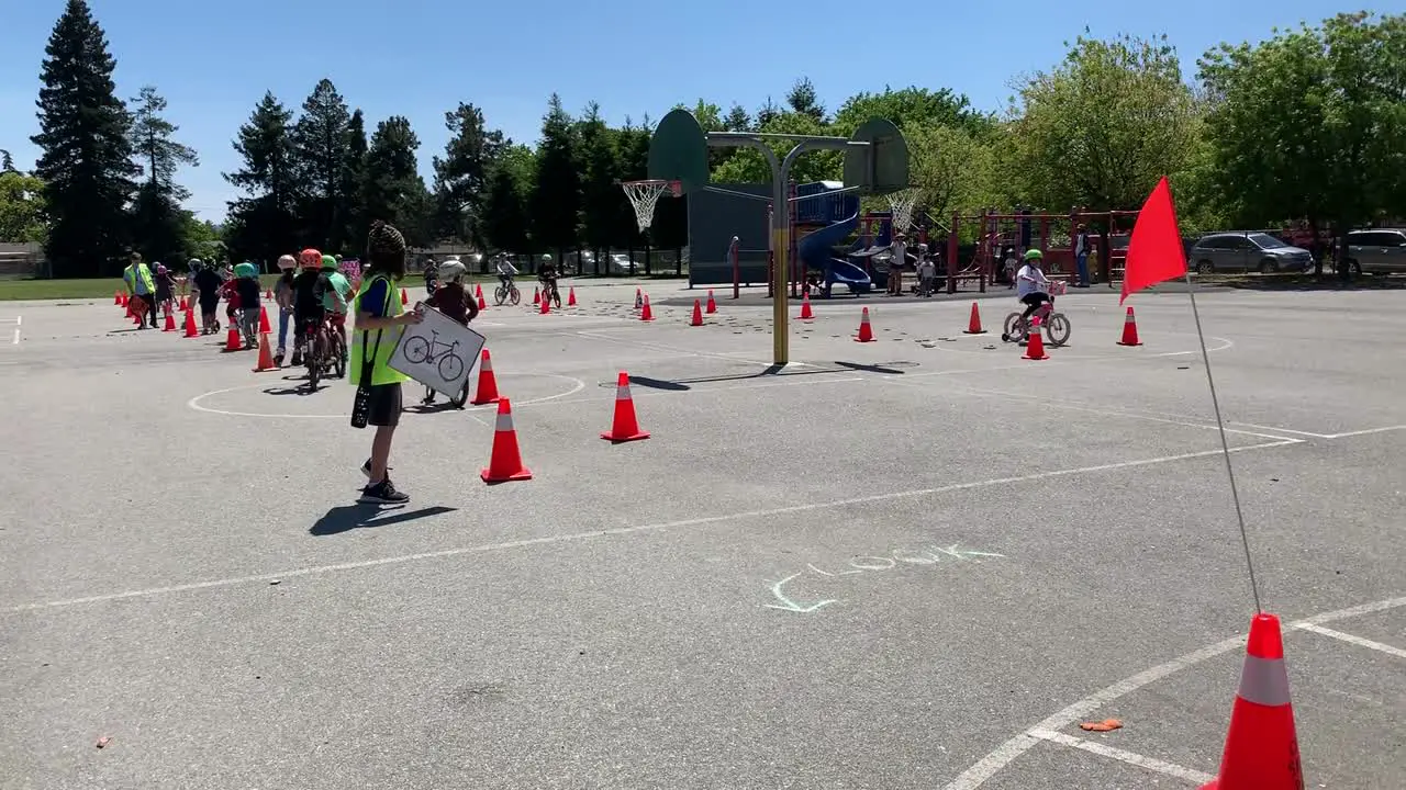 Kids riding bicycles and scooters at a local elementary school