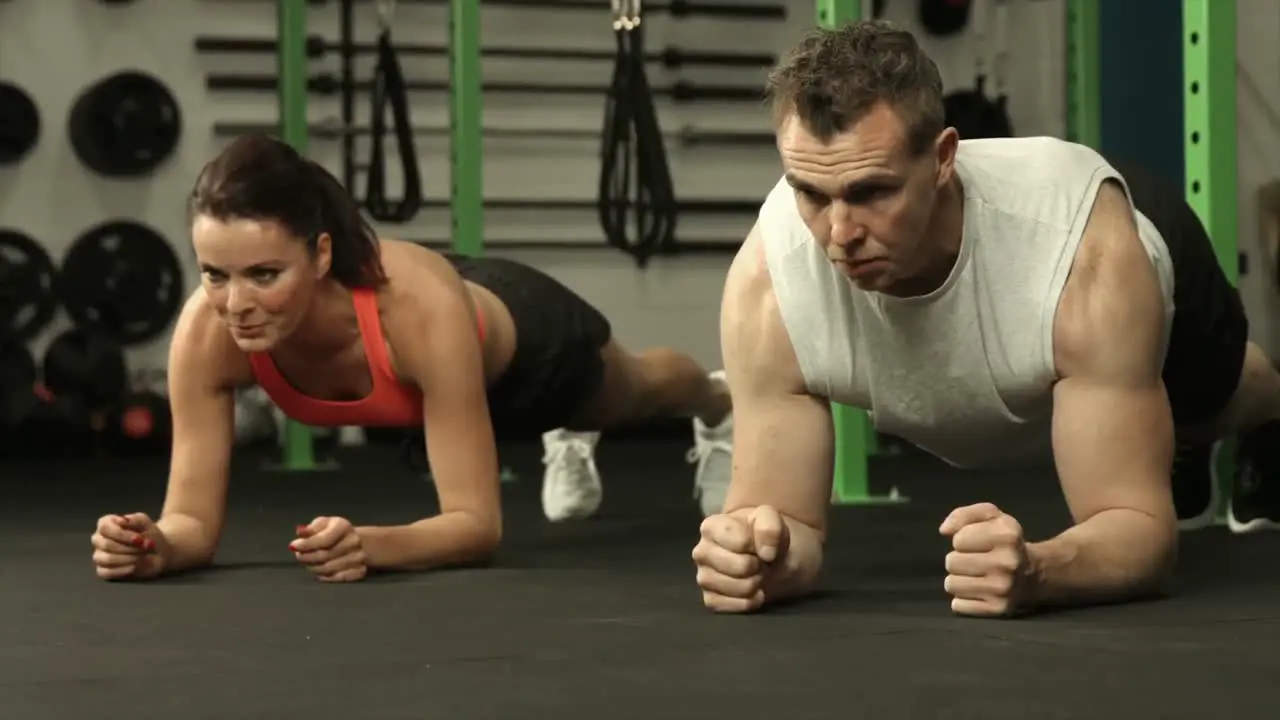 Fit couple in plank position