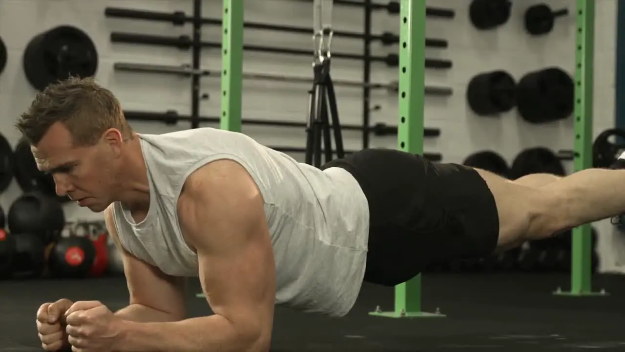 Muscular man in plank position