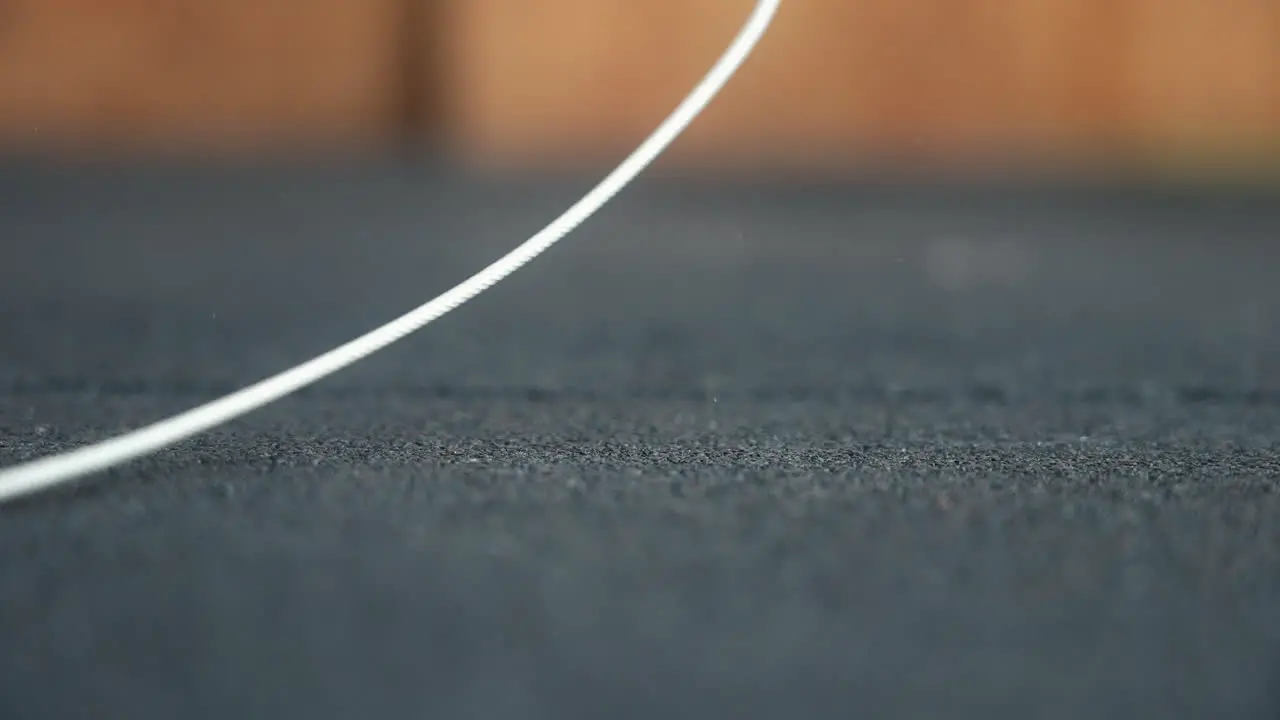 Close up Woman's hands grip a jump rope ready to start a dynamic workout