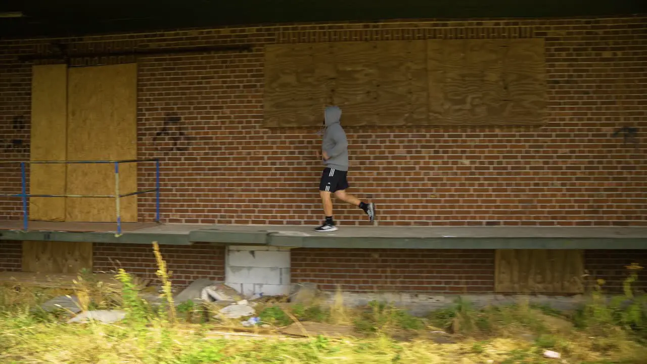 A Man Including Running as Part of His Fitness Routine Tracking Shot