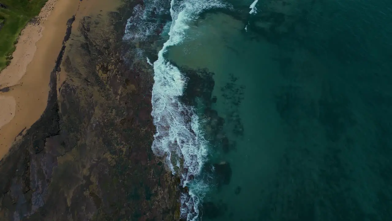 Beautiful rock pool coal coast cliff seaside beach bay at Wollongong near Sydney in New South Wales Australia