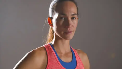 Close Up Shot of Young Woman Looking at Camera at Gym