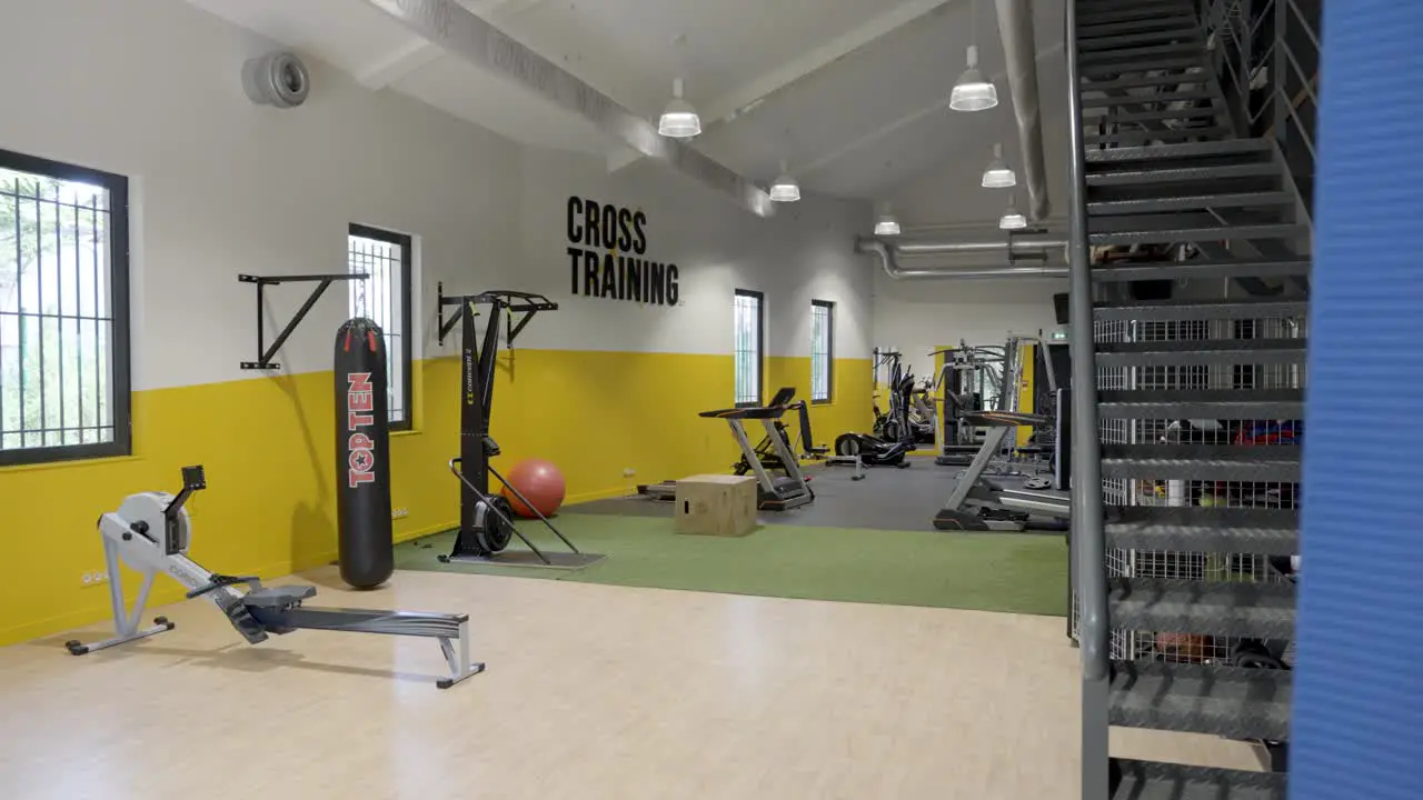 Empty fitness space with fitness equipment boxing bag cardio machines Cross training