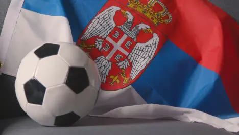 Flag Of Serbia Draped Over Sofa At Home With Football Ready For Match On TV 2