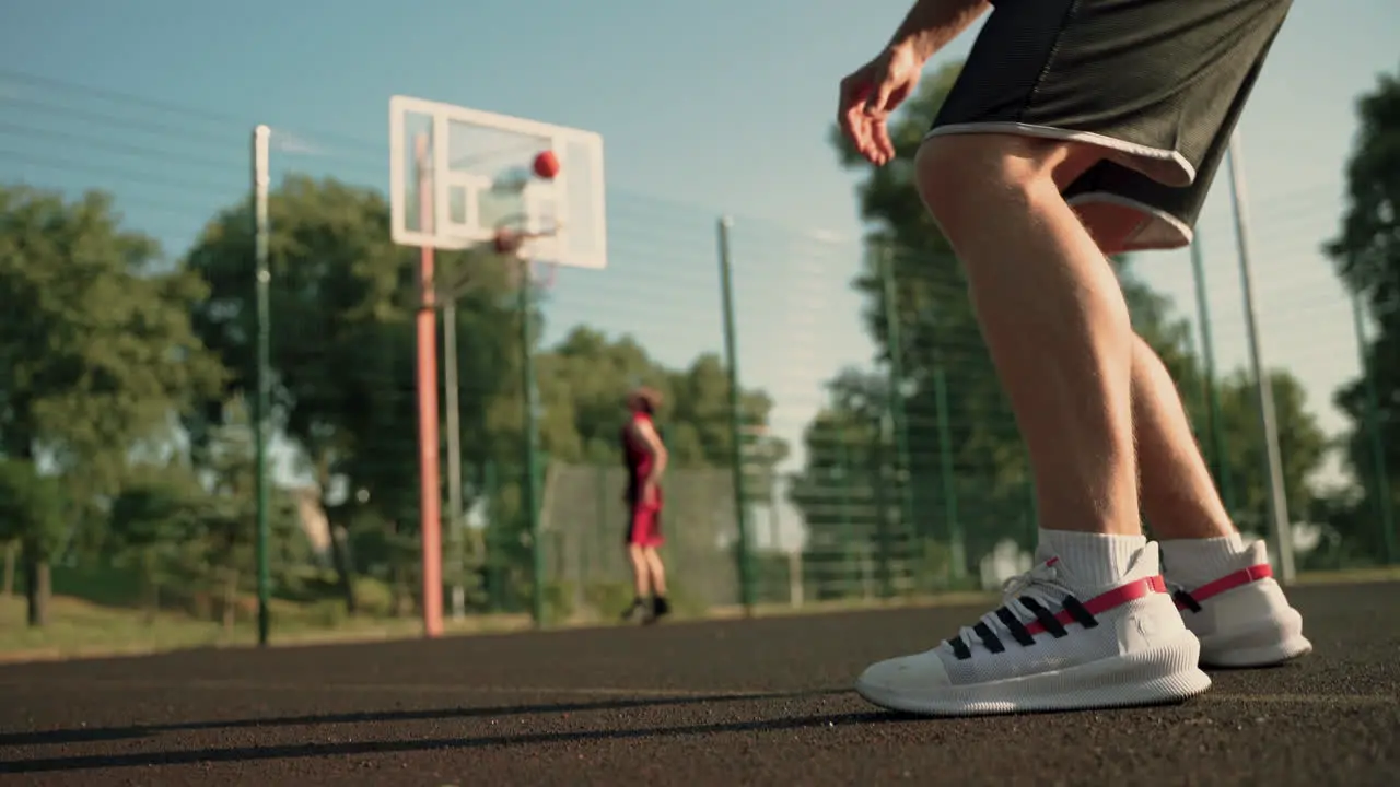 Two Basketball Players Training In An Outdoor Basketball Court