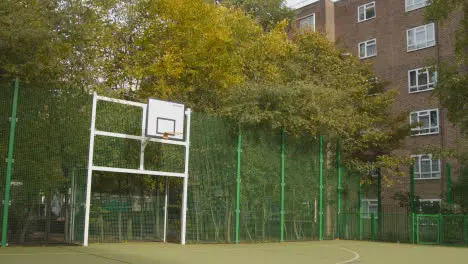 View Of Goal On Empty Artificial Soccer Pitch In Urban City Area 1