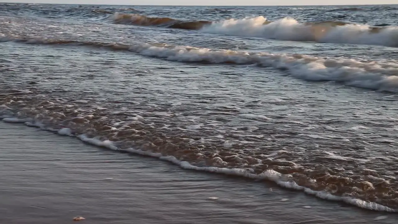 A child runs to the sea to swim