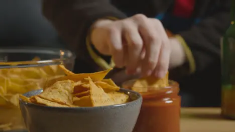 Person At Home Watching American Football Game On TV With Drinks Snacks And Ball 4