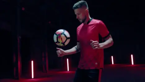 Soccer Player Kicking Up Ball