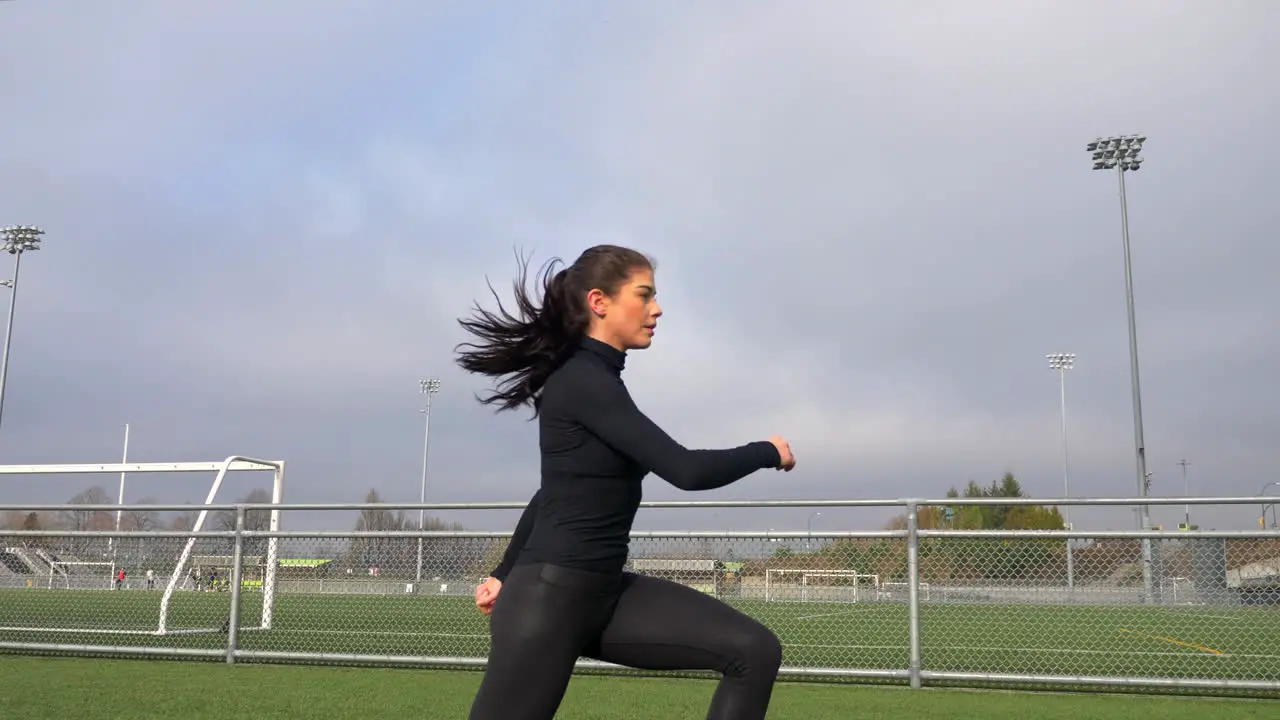 Slim Woman Exercising Outdoor Warming Up With Squat Exercises