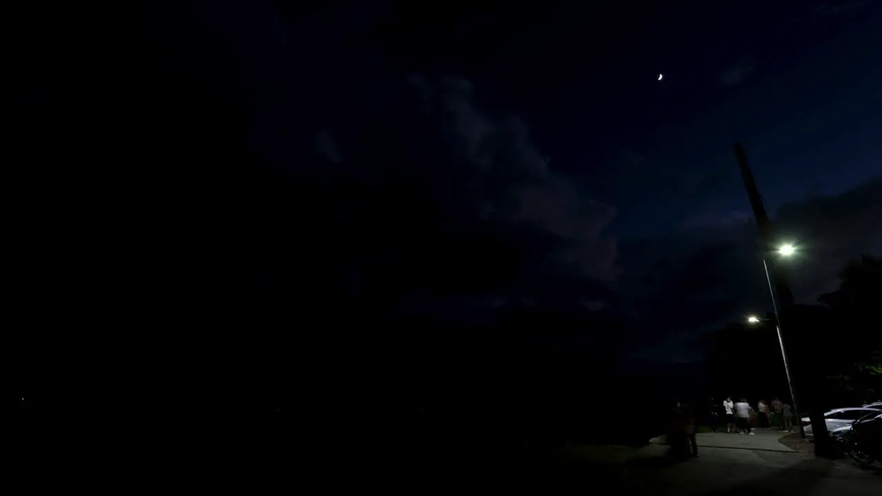 A night timelapse of the malecon of santo domingo near the female obelisc