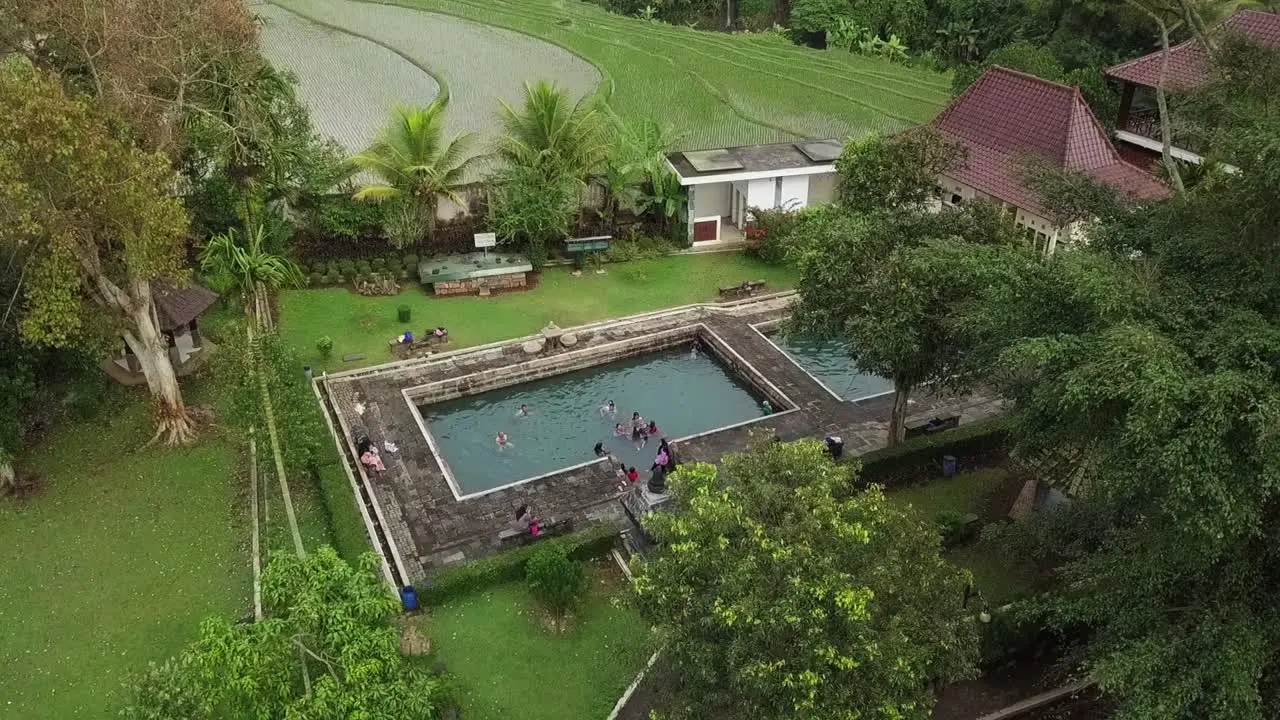 aerial drone view of hot springs from the ancient kingdom named umbul temple in central java indonesia