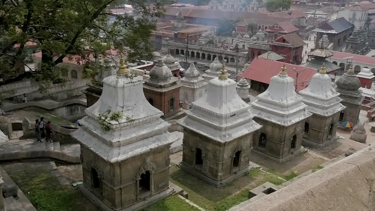 Tracking Shot of Pashupatinath Temple Architecture with Open Cremation Ceremonies in the Background Kathmandu Nepal