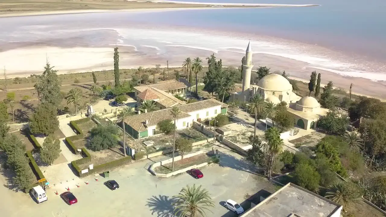 Orbit Shot Of Sultan Hala Tekke Mosque Surrounded By Stunning Salt Lake  Larnaca City  Cyprus