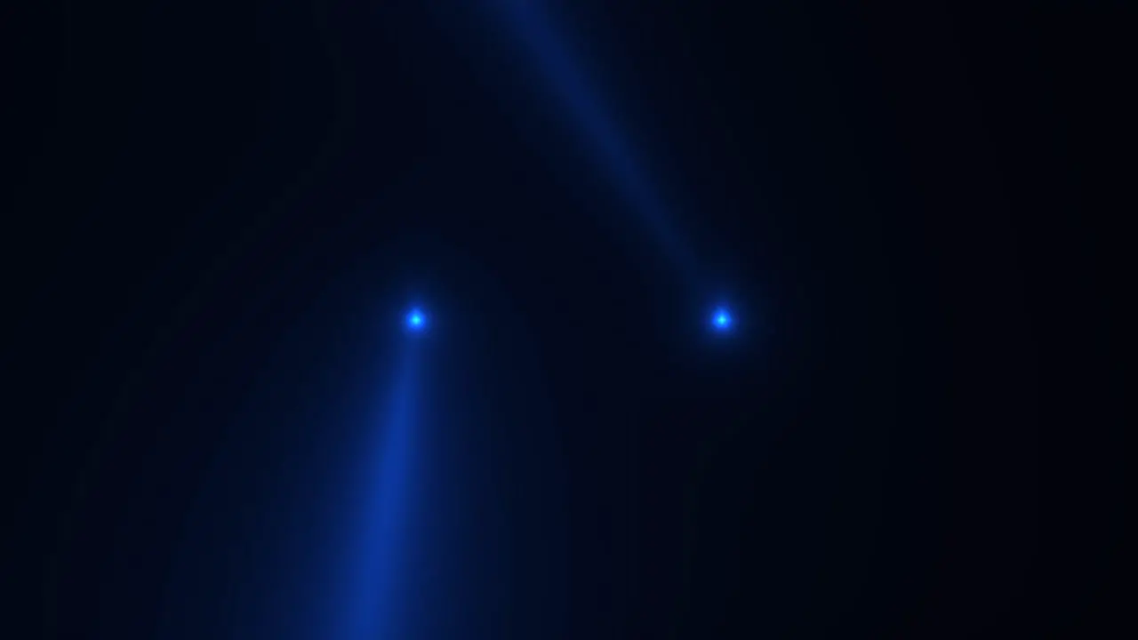 Blue glowing spotlight beams on black gradient stage