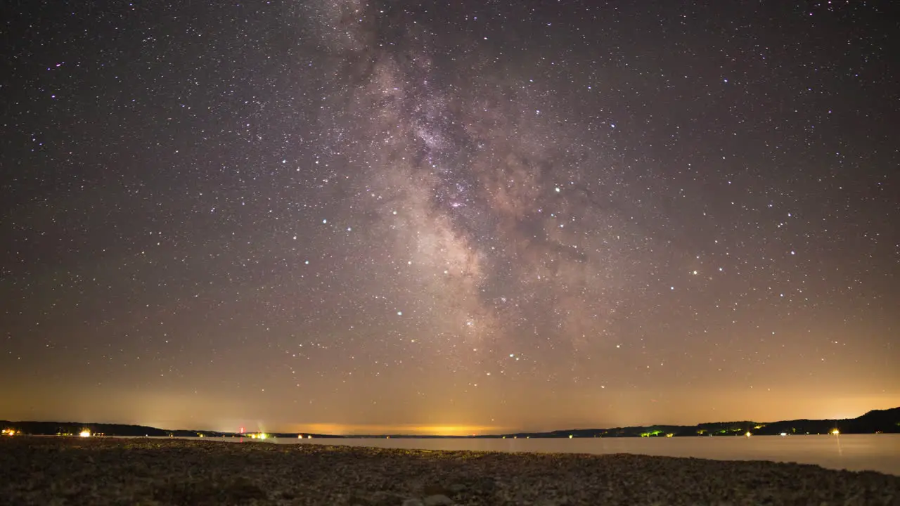 Time-lapse of the Milky Way moving across the sky above a lake