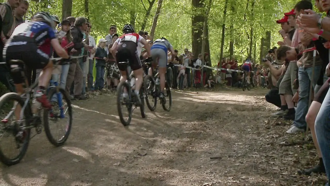 Bicyclists race as a crowd watches 1