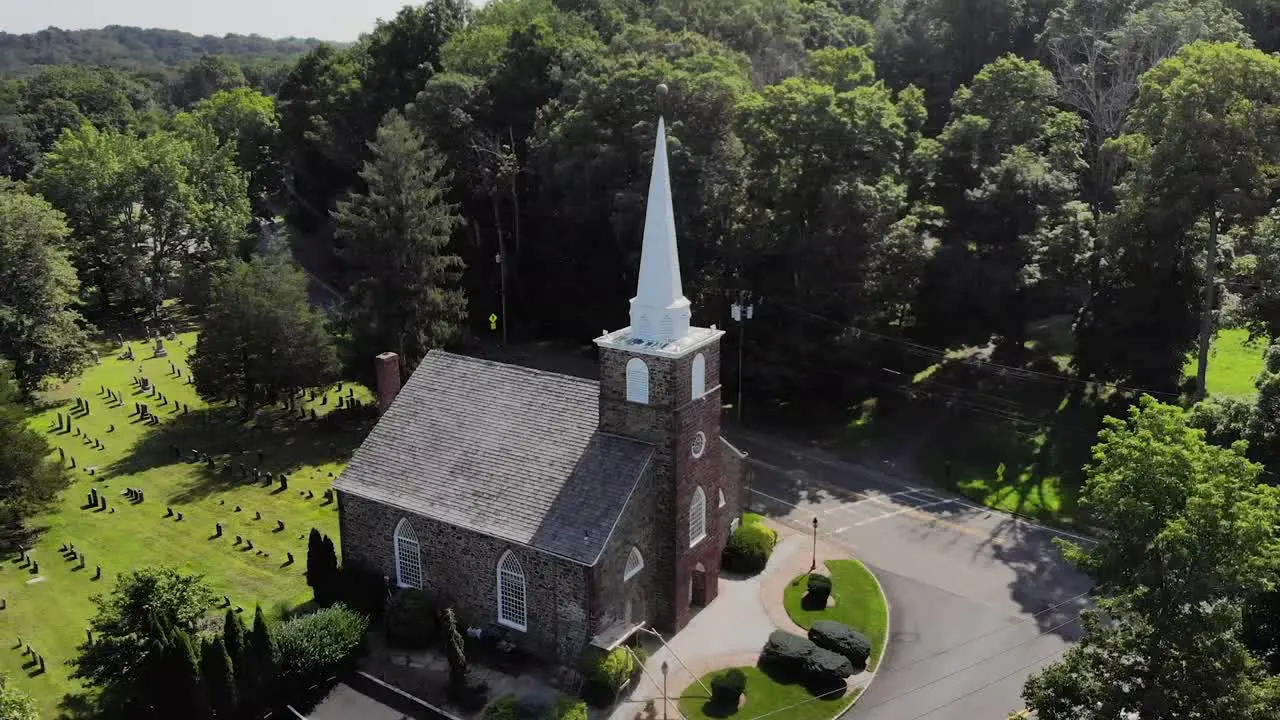 4K Drone shot panning over old stone church