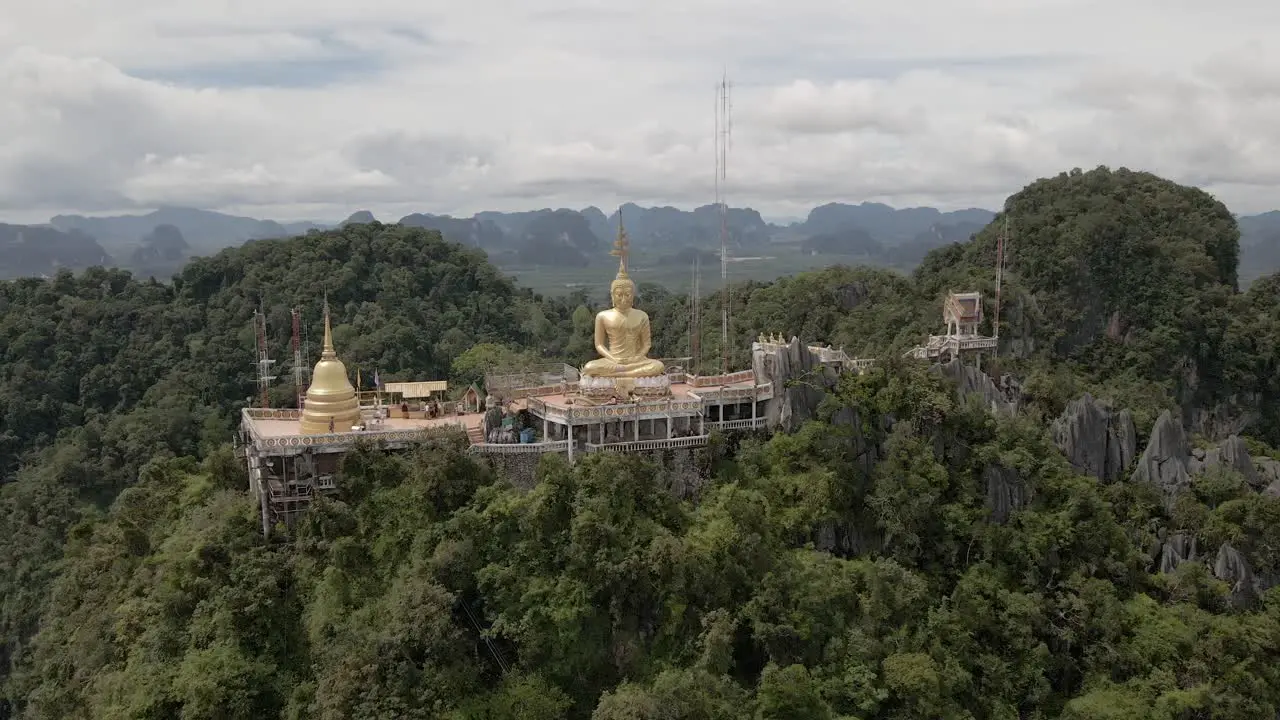 Big gold buddha up on the hill in Thailand