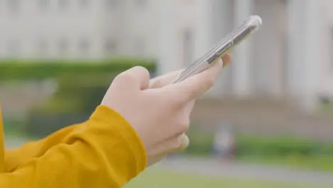 Close Up Shot of Woman Using Phone in Park