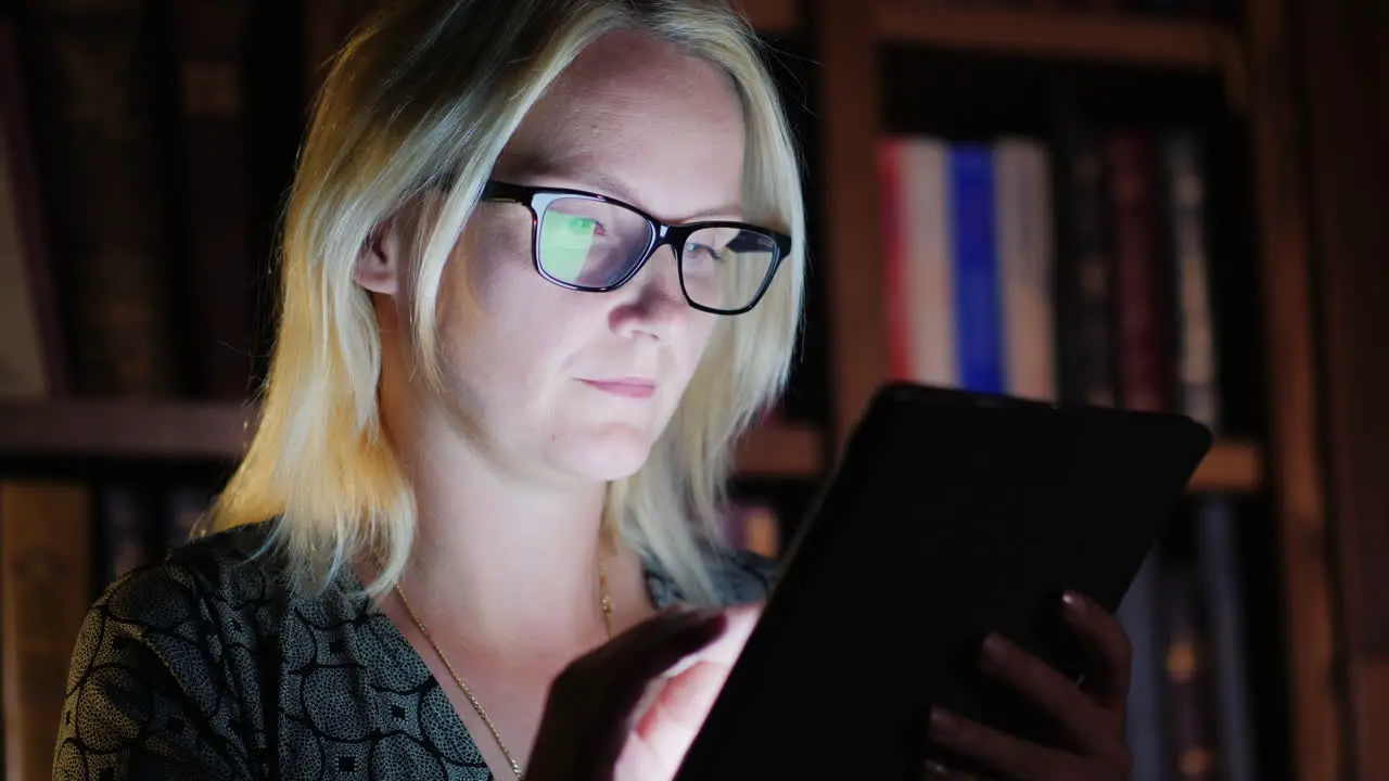 Woman Working on Tablet Late at Night