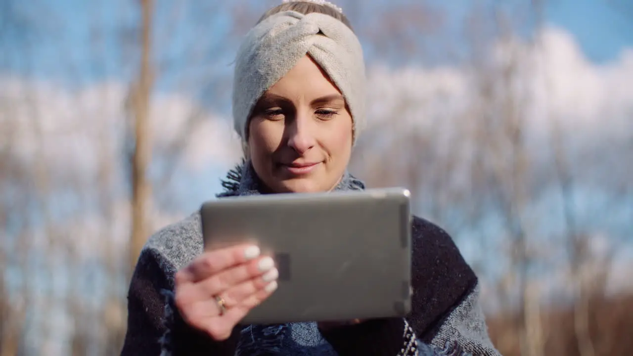 Woman Using Digital Tablet Outdoors On A Trip 3