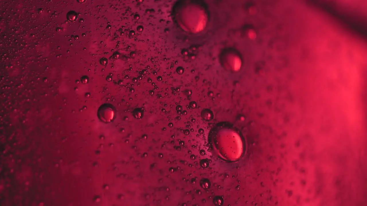 Red abstract bubbles rising in liquid