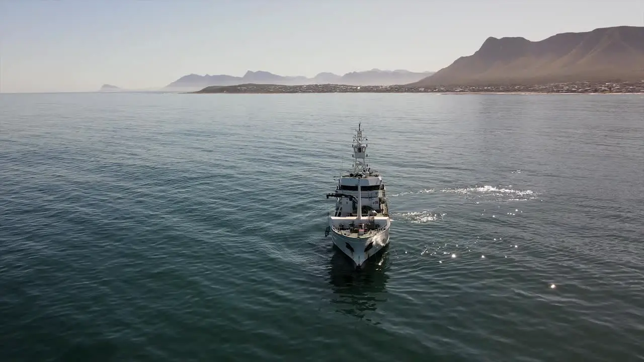 Motor vessel operating off the coast on a calm day