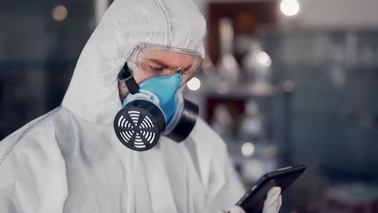 scientist in lab examines tablet