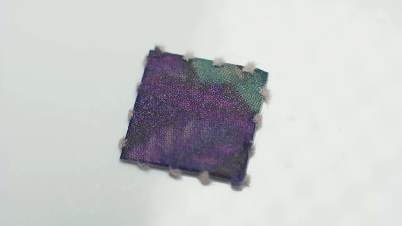 4K Macro shot of a purple acid tab of LSD