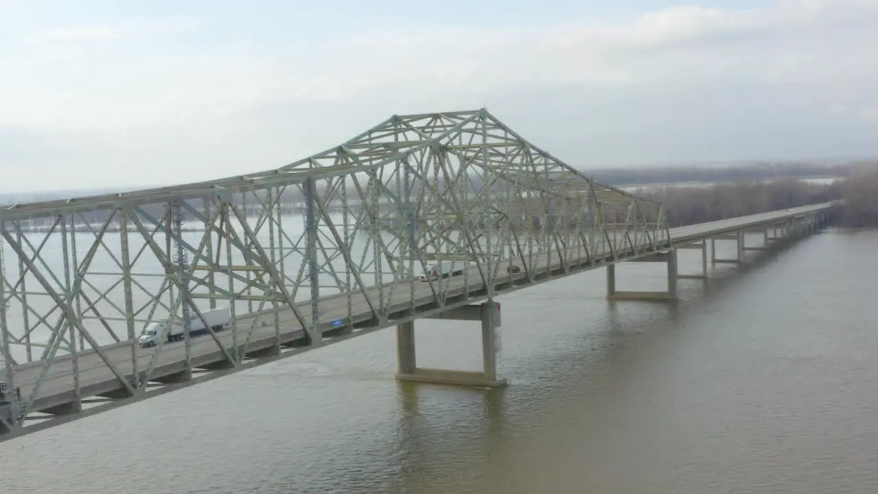 aerial shot of a trailer crossing over a bridge