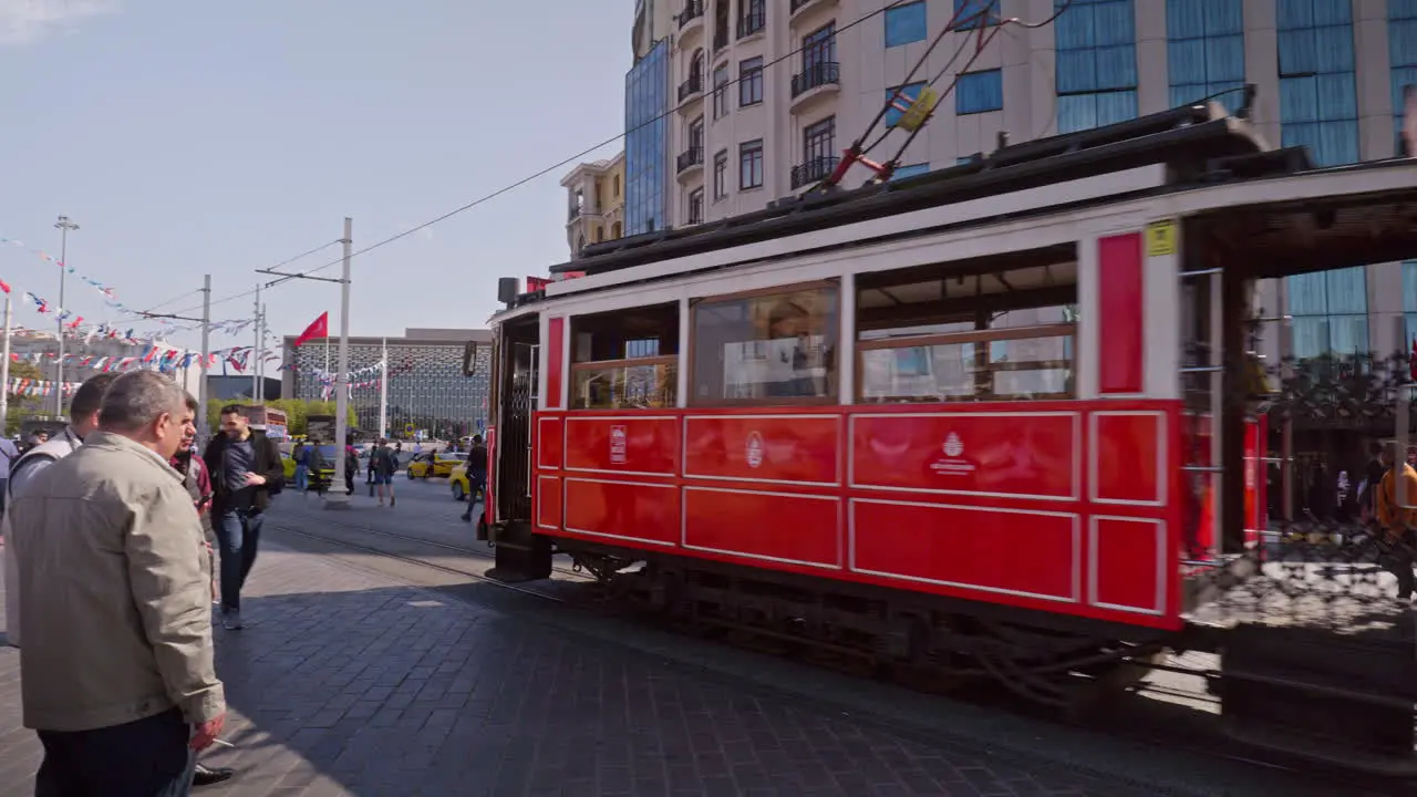 Iconic electric red tram arrives at Taksim square terminus Istanbul