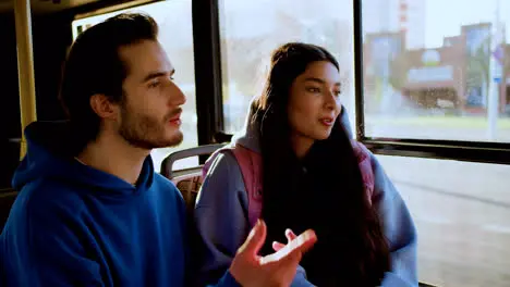 Young couple sitting in the bus