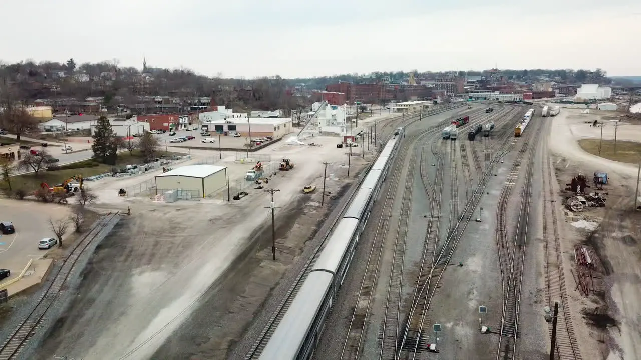 Aerial of the Southwest Chief Amtrak train traveling through a railroad yard near Burlington Iowa 1