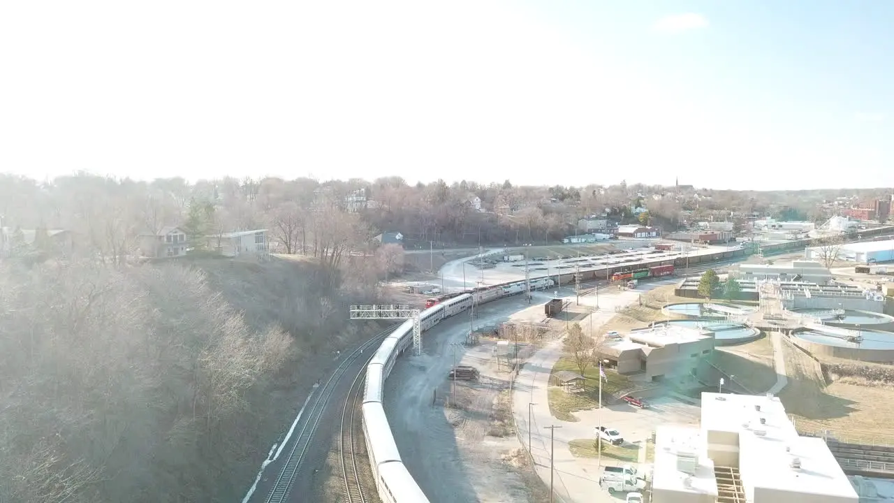 Aerial of the Southwest Chief Amtrak train traveling through a railroad yard near Burlington Iowa 2