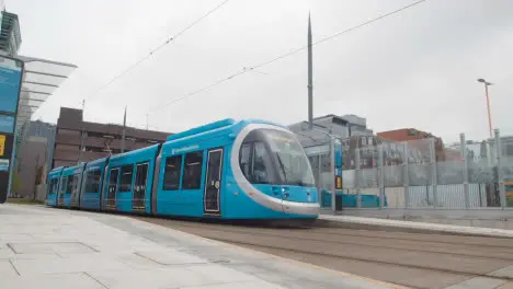 Tram Leaving Station Stop Platform In Birmingham UK 1