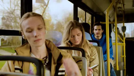 Young man listening the music in the bus