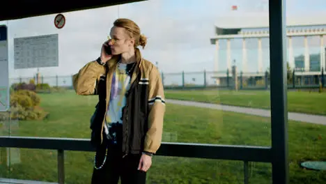 Young man at bus stop