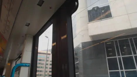 View From Inside Tram Through Window Of Office Buildings In Birmingham UK