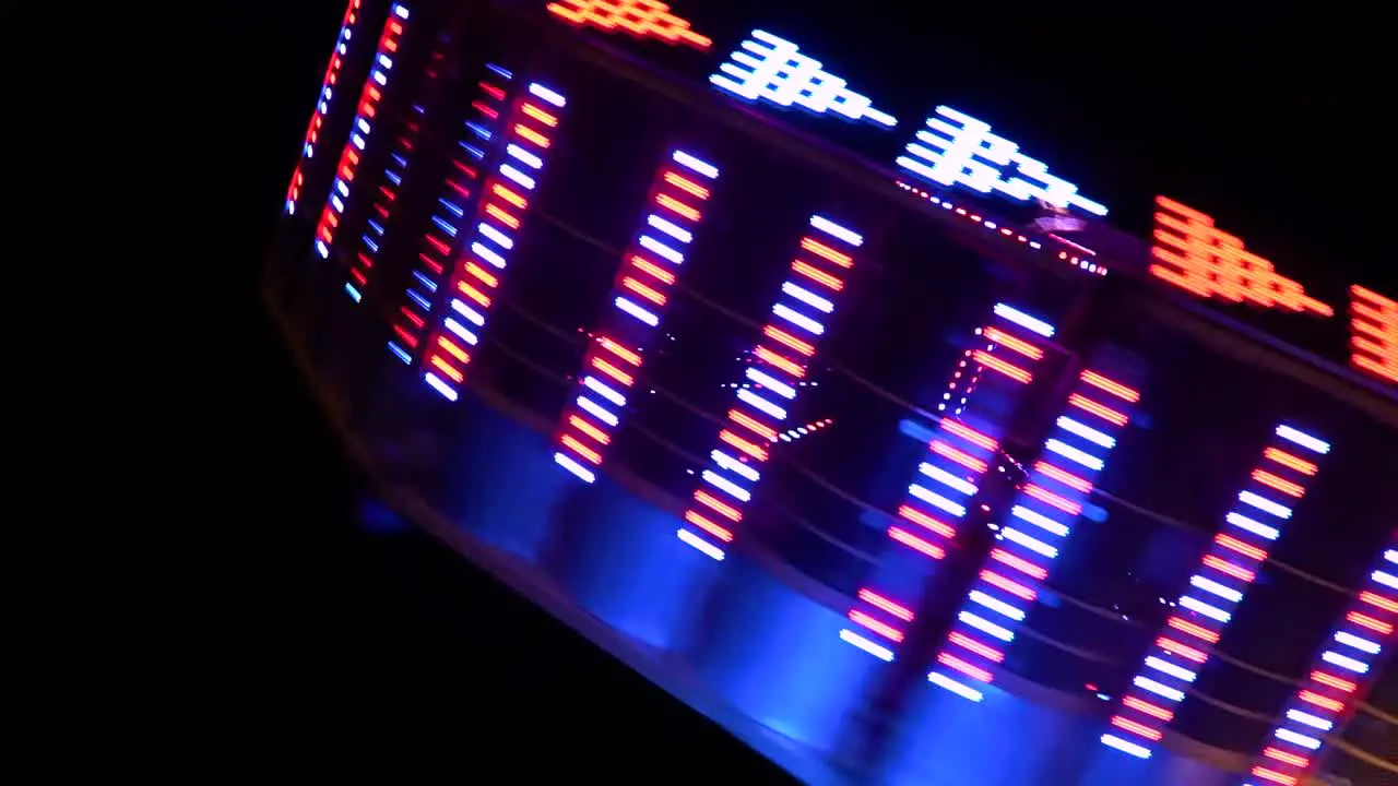 Spinning carnival ride at night