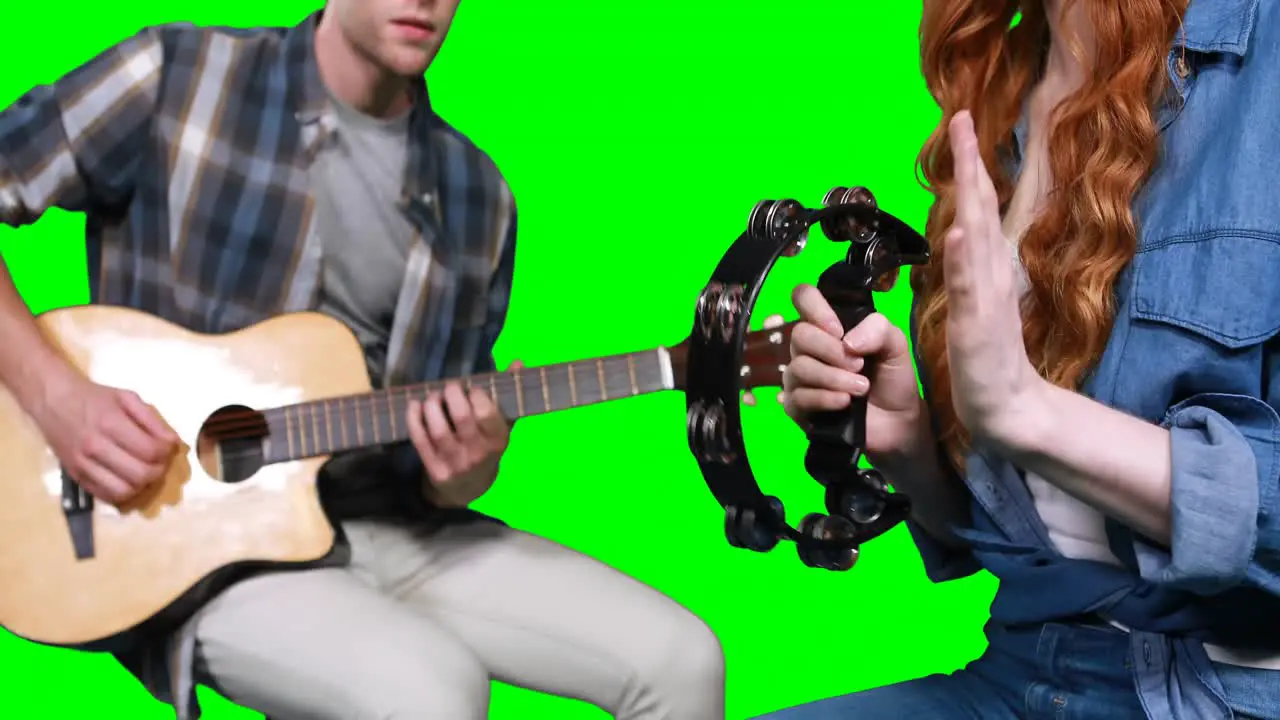 Musicians playing guitar and tambourine