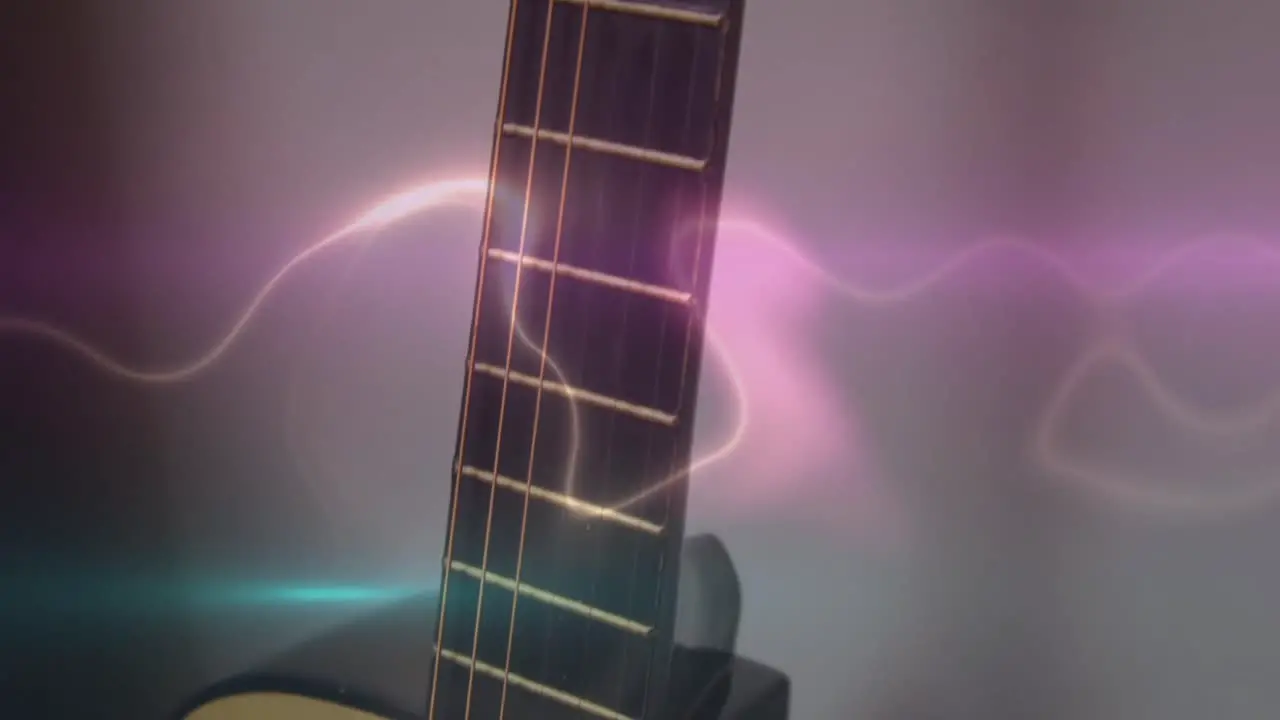 Animation of white blue and pink light trails over acoustic guitar on smokey background