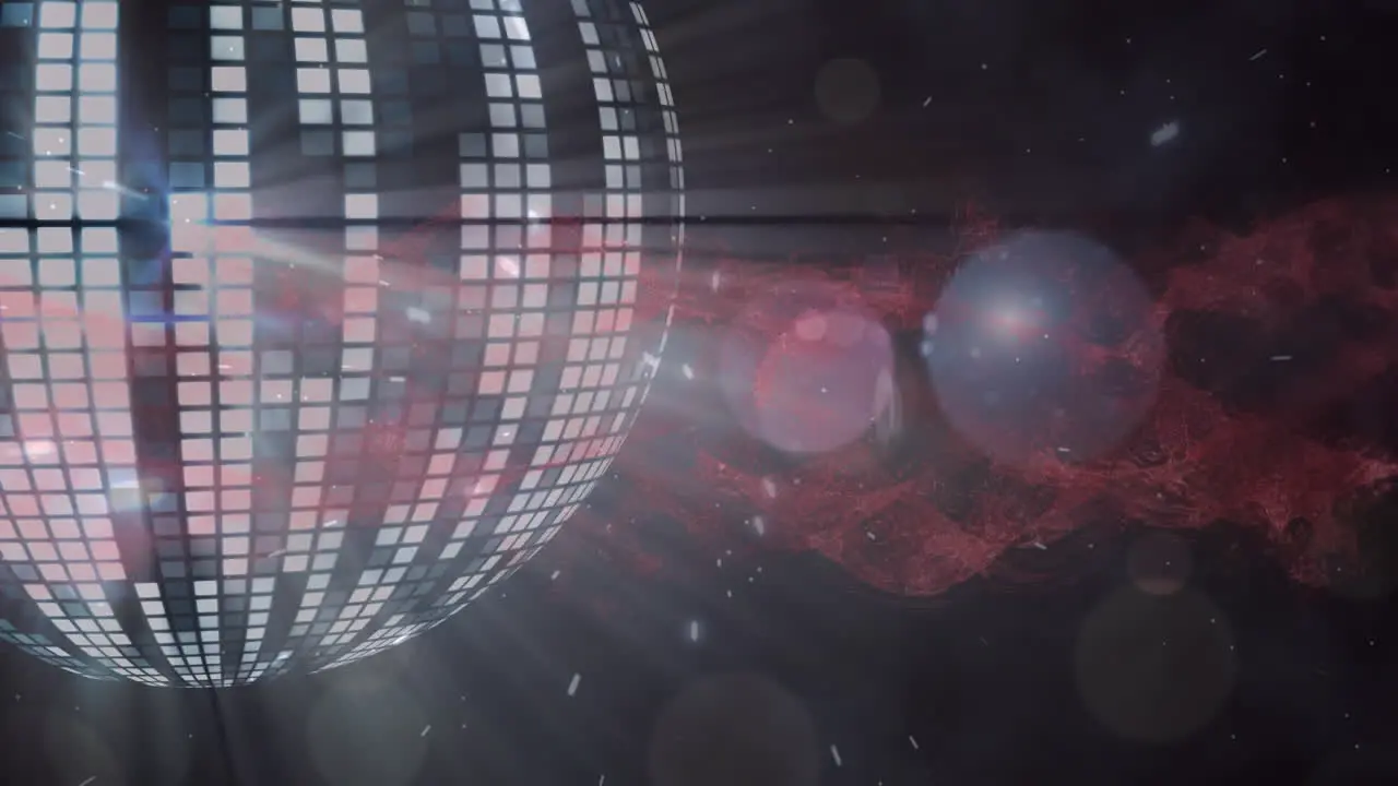 Animation of spots of light over mirror ball on black background